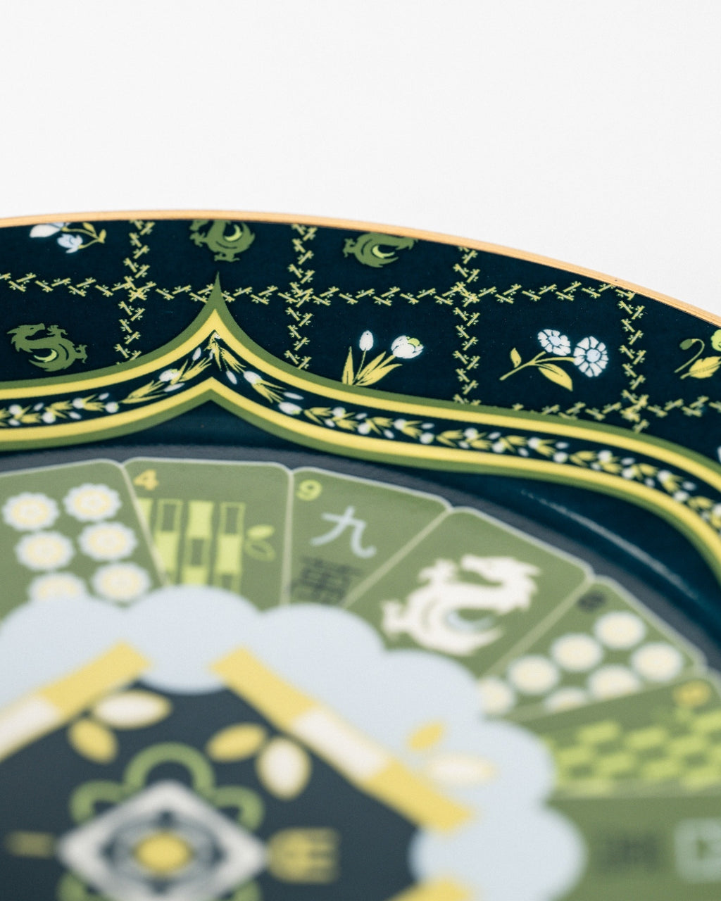 Duali ceramic tea set close-up showing floral motifs and intricate gold decorative detailing