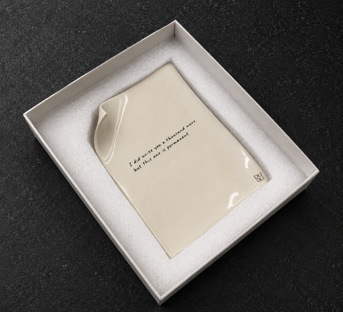 Forever Fold white box interior showing cream colored card with handwritten text surrounded by white foam padding
