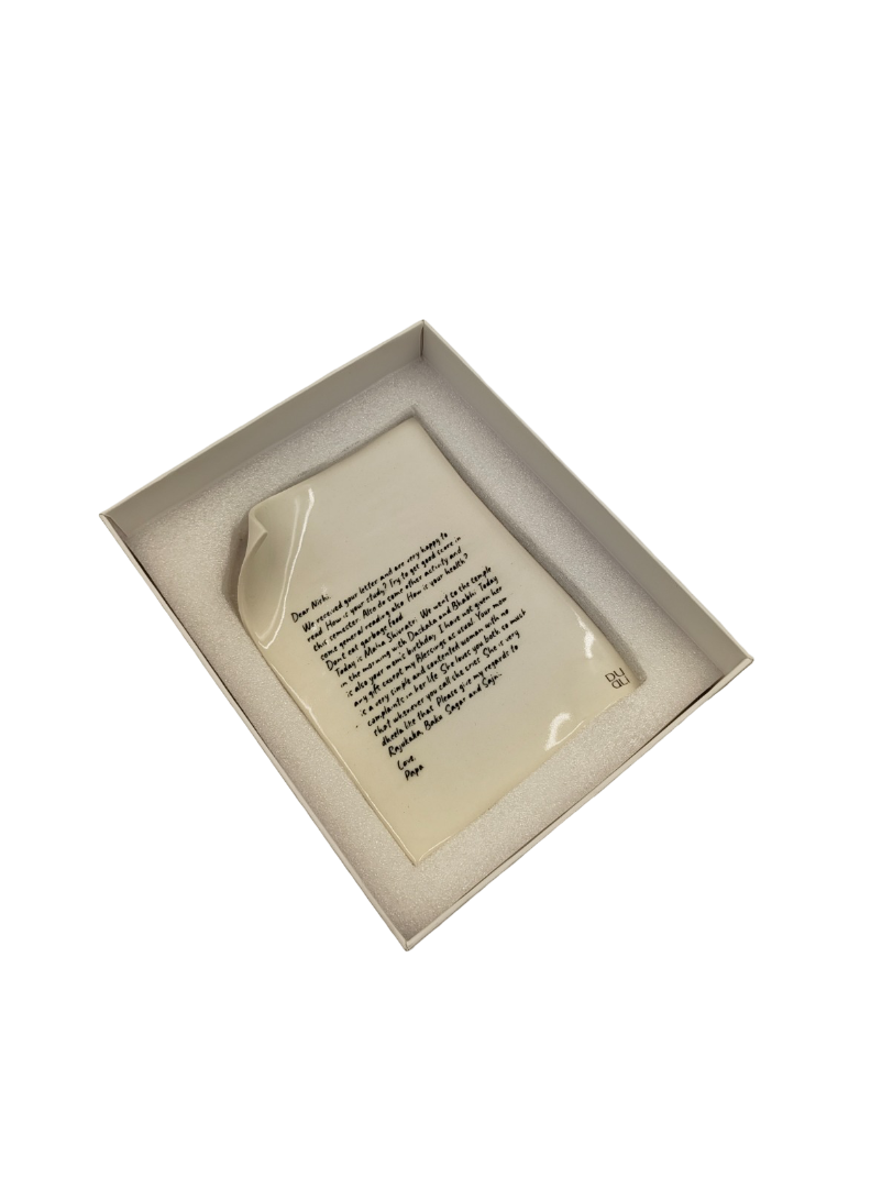 Forever Fold branded white product box photographed at angle, showing printed label inside on transparent background